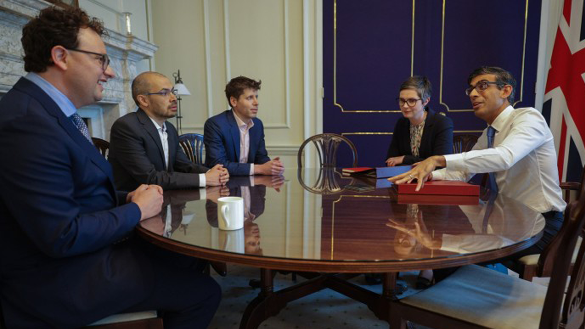 Archival photograph from May 24, 2023 showing Anthropic CEO Dario Amodei, Google DeepMind CEO Demis Hassabis, and OpenAI CEO Sam Altman meeting with UK Prime Minister Rishi Sunak and UK Secretary of State for Science, Innovation and Technology Michelle Donelan at 10 Downing Street, London.